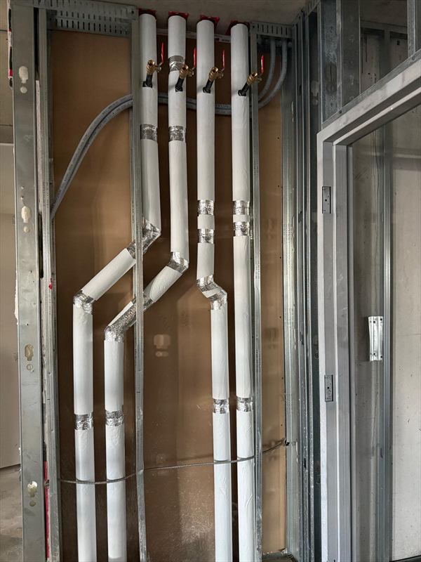 Insulated piping in mechanical chase